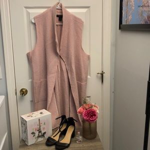 Long pink sleeveless vest- with a matching pink scarf!